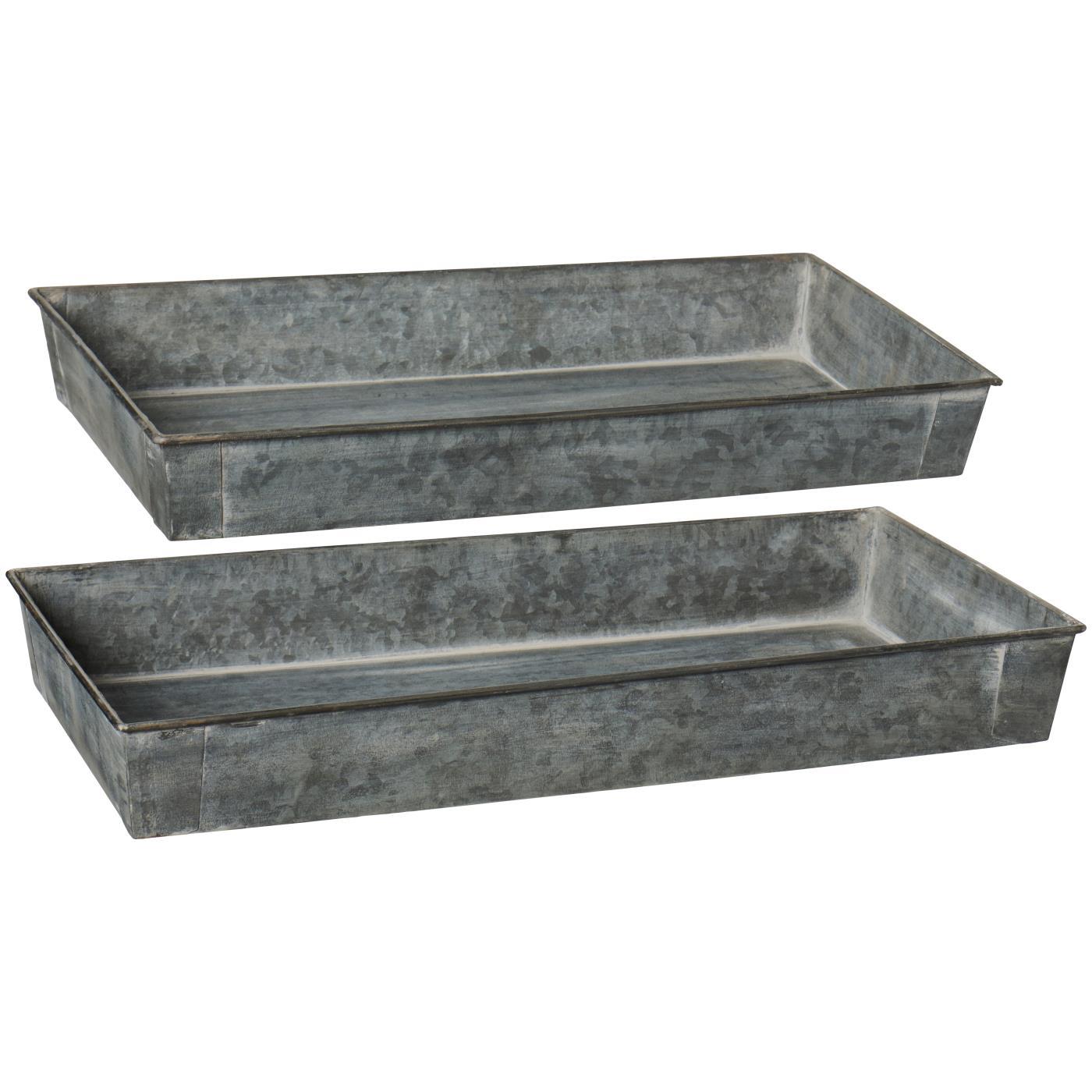 Two galvanized metal troughs on a white background