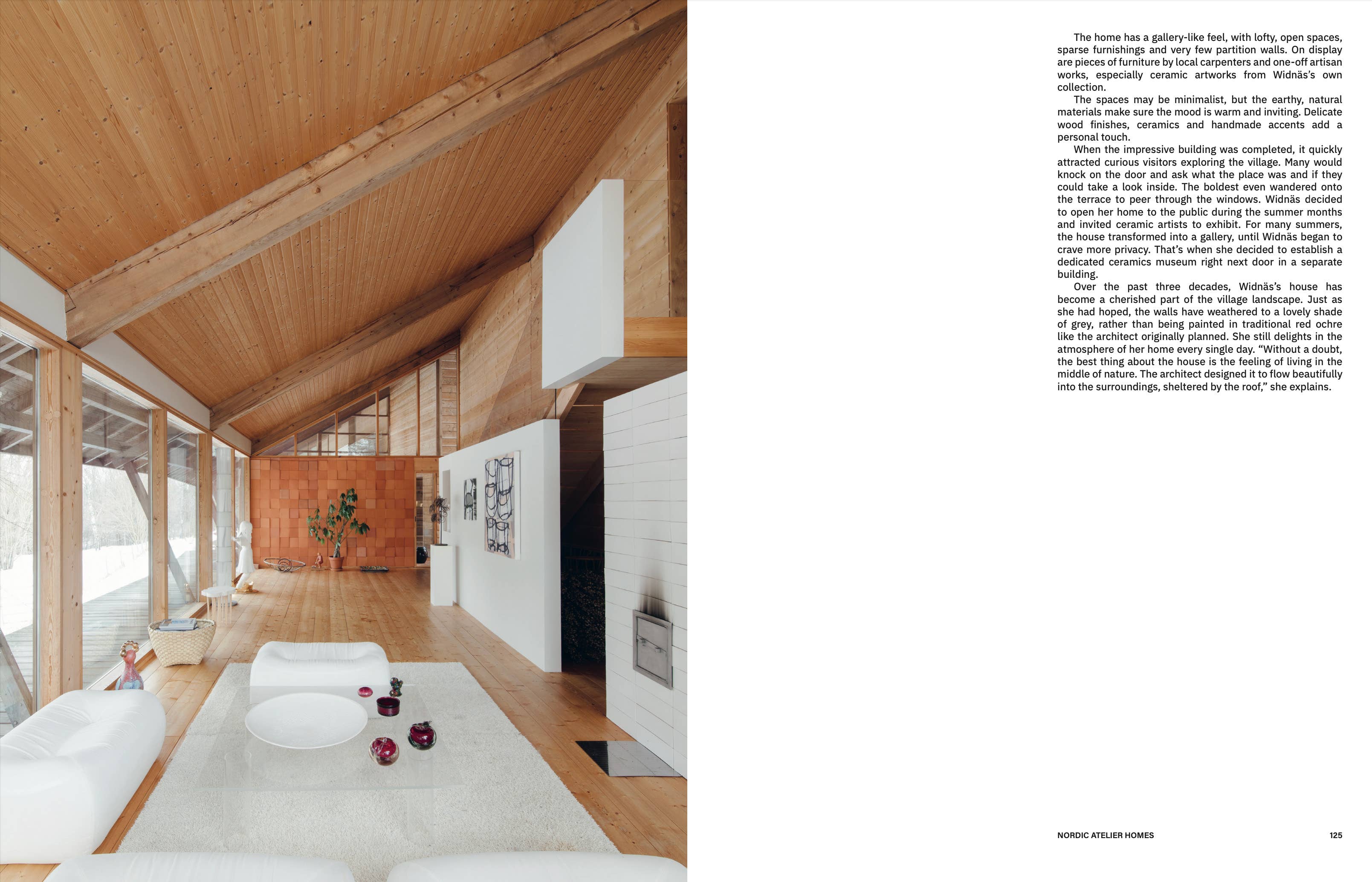 Modern interior design with wooden ceiling and white furniture.