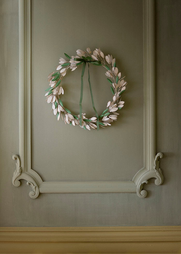 Decorative wreath on a paneled wall